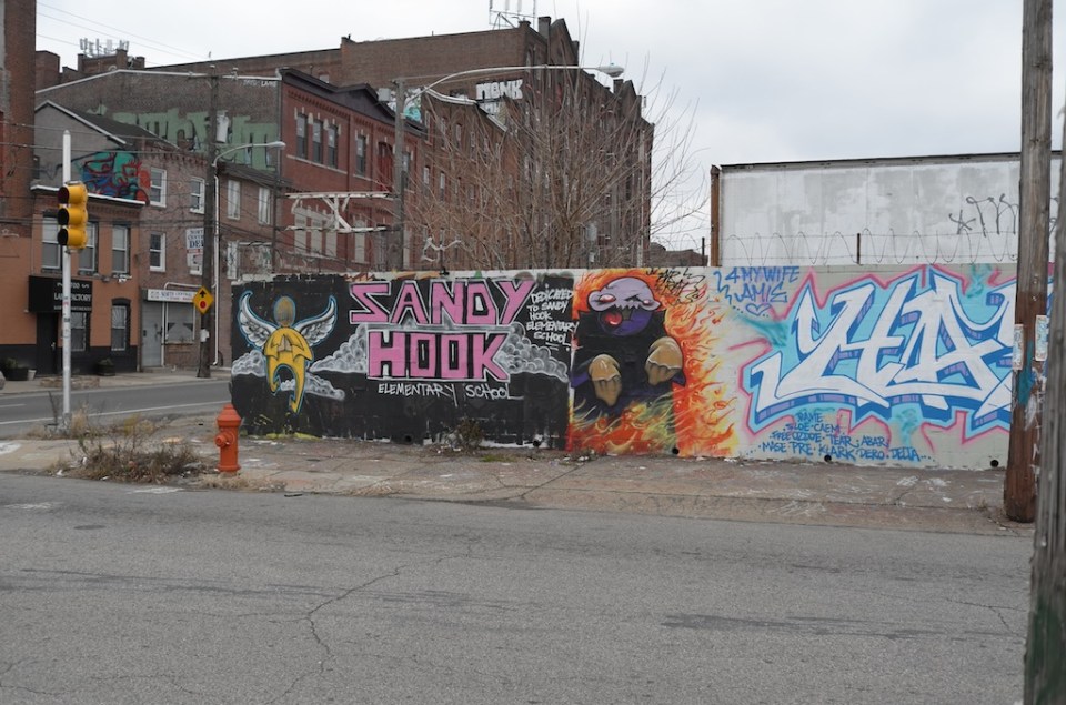 A memorial to the victims of the Sandy Hook shootings at the intersection of 5th and Cecil B. Moore, a so-called “Murder Corridor” in North Philadelphia. From 2007 to 2013, 299 children were murdered in city; the majority of these victims were black, and shot to death in North Philly. Photo Copyright Jason Francisco (2012).